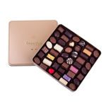 Τετράγωνο χρυσό μεταλλικό κουτί με 670 γρ. ποικιλία σοκολατάκια Leonidas