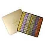 Τετράγωνο χρυσό μεταλλικό κουτί με 1,79 κιλά σοκολατάκια gianduja, giantina, giamanda Leonidas