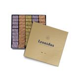 Χάρτινο χρυσὀ τετράγωνο κουτί Heritage M με 1,13 κιλά πραλίνες gianduja, giantina, giamanda Leonidas.