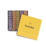 Χάρτινο κίτρινο τετράγωνο κουτί Heritage M με 1,13 κιλά πραλίνες gianduja, giantina, giamanda Leonidas