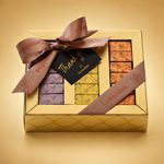 Χρυσό κουτί με 36 σοκολατάκια gianduja, giantina, giamanda Leonidas